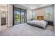 Spacious main bedroom featuring a private balcony with scenic water views and plenty of natural light at 4849 Isola Ct, Wesley Chapel, FL 33543