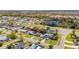 Aerial view shows the home's location near a pond in a well-developed neighborhood at 564 Florida S Cir, Apollo Beach, FL 33572