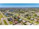 Wide aerial view of a residential neighborhood with waterfront access and mature trees at 564 Florida S Cir, Apollo Beach, FL 33572