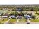 Aerial view of a home with a well-manicured lawn in a quiet neighborhood at 564 Florida S Cir, Apollo Beach, FL 33572