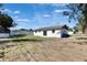 Backyard featuring green grass, a shed, and boat parking at 564 Florida S Cir, Apollo Beach, FL 33572