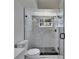 Sleek bathroom with glass enclosed shower, marble-style tile, and modern fixtures for a spa-like experience at 564 Florida S Cir, Apollo Beach, FL 33572