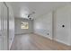 Open bedroom with fan and views of landscape outside at 564 Florida S Cir, Apollo Beach, FL 33572