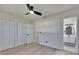 Bedroom featuring hardwood floors, ceiling fan, a closet, and attached bathroom at 564 Florida S Cir, Apollo Beach, FL 33572