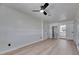 Bright bedroom featuring modern ceiling fan and light hardwood floors, offering a fresh and spacious feel at 564 Florida S Cir, Apollo Beach, FL 33572