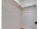 Empty closet featuring white walls, shelving, and ample space for organizing clothes and accessories at 564 Florida S Cir, Apollo Beach, FL 33572