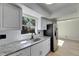 Beautiful kitchen with stainless steel refrigerator and an eat-in area at 564 Florida S Cir, Apollo Beach, FL 33572