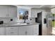 Modern kitchen with granite countertops and stainless steel refrigerator at 564 Florida S Cir, Apollo Beach, FL 33572