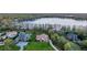 High-angle view highlighting luxury homes with manicured lawns and waterfront access at 5914 Fitzgerald Rd, Odessa, FL 33556
