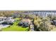Aerial view of an elegant two-story home featuring a tile roof and luscious green landscaping at 5914 Fitzgerald Rd, Odessa, FL 33556