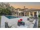 Beautiful backyard with a large pool, outdoor seating areas, and mature trees at 5914 Fitzgerald Rd, Odessa, FL 33556