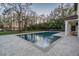 Backyard pool with a tranquil fountain feature, and lush landscaping that offers privacy at 5914 Fitzgerald Rd, Odessa, FL 33556