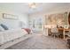 Bright bedroom with a built-in bed frame, French doors, and a desk creates a cozy and functional space at 5914 Fitzgerald Rd, Odessa, FL 33556