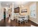 Charming dining area featuring a chandelier, breakfast nook, and elegant decor at 5914 Fitzgerald Rd, Odessa, FL 33556