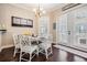 Inviting dining area with access to the outdoors and a view of the chandelier at 5914 Fitzgerald Rd, Odessa, FL 33556