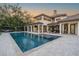Spacious backyard with a large pool, outdoor seating, and lush greenery at 5914 Fitzgerald Rd, Odessa, FL 33556