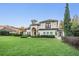 Stunning home boasts lush lawn, mature landscaping, and elegant Mediterranean-style architecture at 5914 Fitzgerald Rd, Odessa, FL 33556