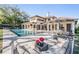 Stunning exterior view of home with a spacious pool, outdoor seating, and lush landscaping at 5914 Fitzgerald Rd, Odessa, FL 33556