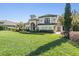 Stunning home boasts lush lawn, mature landscaping, and elegant Mediterranean-style architecture at 5914 Fitzgerald Rd, Odessa, FL 33556
