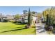 Elegant two-story home featuring a tile roof, manicured landscaping, and arched entryway at 5914 Fitzgerald Rd, Odessa, FL 33556
