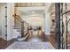 Grand foyer with a staircase, soaring ceilings, and an open design, creating a welcoming ambiance at 5914 Fitzgerald Rd, Odessa, FL 33556