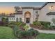 Elegant front exterior showcasing manicured landscaping and a welcoming entrance at 5914 Fitzgerald Rd, Odessa, FL 33556