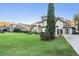 Stunning home boasts lush lawn, mature landscaping, and elegant Mediterranean-style architecture at 5914 Fitzgerald Rd, Odessa, FL 33556