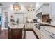 Spacious kitchen with granite countertops, stainless steel appliances, and a dark wood island at 5914 Fitzgerald Rd, Odessa, FL 33556