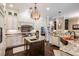 Modern kitchen with granite countertops, stainless steel appliances, and a central island at 5914 Fitzgerald Rd, Odessa, FL 33556