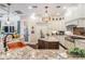 Modern kitchen with granite countertops, a central island, and sleek white cabinets at 5914 Fitzgerald Rd, Odessa, FL 33556