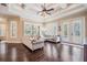 Cozy living room with hardwood floors, coffered ceilings, and a comfortable sectional sofa at 5914 Fitzgerald Rd, Odessa, FL 33556