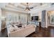 Comfortable living room with coffered ceilings, hardwood floors, and backyard access at 5914 Fitzgerald Rd, Odessa, FL 33556
