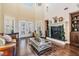 Inviting living area with high ceilings, a fireplace, and lots of natural light at 5914 Fitzgerald Rd, Odessa, FL 33556