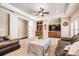 Comfortable living room features a tray ceiling, recessed lighting, custom cabinetry, and plush seating at 5914 Fitzgerald Rd, Odessa, FL 33556