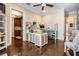 Bright office space with desk, storage, hardwood floors and adjoining kitchen at 5914 Fitzgerald Rd, Odessa, FL 33556