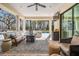 Covered outdoor patio featuring a seating area, ceiling fan, and views of pool at 5914 Fitzgerald Rd, Odessa, FL 33556
