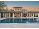Expansive backyard features a large pool with fountain feature, surrounded by outdoor living spaces at 5914 Fitzgerald Rd, Odessa, FL 33556