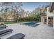Beautiful backyard oasis with a large pool and comfortable lounge area, perfect for relaxation and entertainment at 5914 Fitzgerald Rd, Odessa, FL 33556