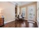 Cozy sitting room area featuring hardwood floors, natural light, and comfortable seating at 5914 Fitzgerald Rd, Odessa, FL 33556