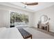 This primary bedroom features sliding glass doors that lead to the lanai and pool area at 7122 Bowspirit Pl, Apollo Beach, FL 33572