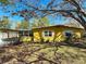 Lovely single-story home with large windows and a covered carport with shade from a mature tree at 7211 10Th N Ave, St Petersburg, FL 33710