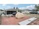 Backyard features a covered boat, red brick patio, and partial views of the home's exterior at 7740 Bracken Dr, Port Richey, FL 34668