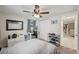 Bedroom with a ceiling fan, closet and desk with neutral colors at 7740 Bracken Dr, Port Richey, FL 34668