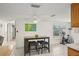 Cozy dining area with stylish table, seating, and bright natural lighting at 7740 Bracken Dr, Port Richey, FL 34668