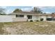Lovely single-story home has a well-kept lawn, neutral paint, and an attached garage for convenience at 7740 Bracken Dr, Port Richey, FL 34668