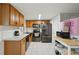 Well-equipped kitchen with stainless steel appliances, a modern sink, and ample cabinet space at 7740 Bracken Dr, Port Richey, FL 34668