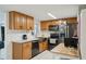 Modern kitchen with sleek appliances, and wooden cabinetry and plenty of counter space at 7740 Bracken Dr, Port Richey, FL 34668