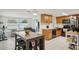 Open concept design with a bright living space seamlessly connects to the modern kitchen at 7740 Bracken Dr, Port Richey, FL 34668