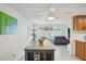 Bright living room featuring a modern ceiling fan and comfortable seating area at 7740 Bracken Dr, Port Richey, FL 34668