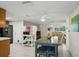 Open floor plan connecting the kitchen and dining areas with a view to the living room at 7740 Bracken Dr, Port Richey, FL 34668